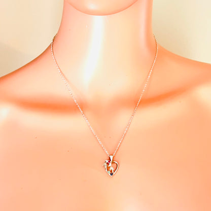 Avon sterling gemstone heart necklace displayed on mannequin showing 18-inch chain length.