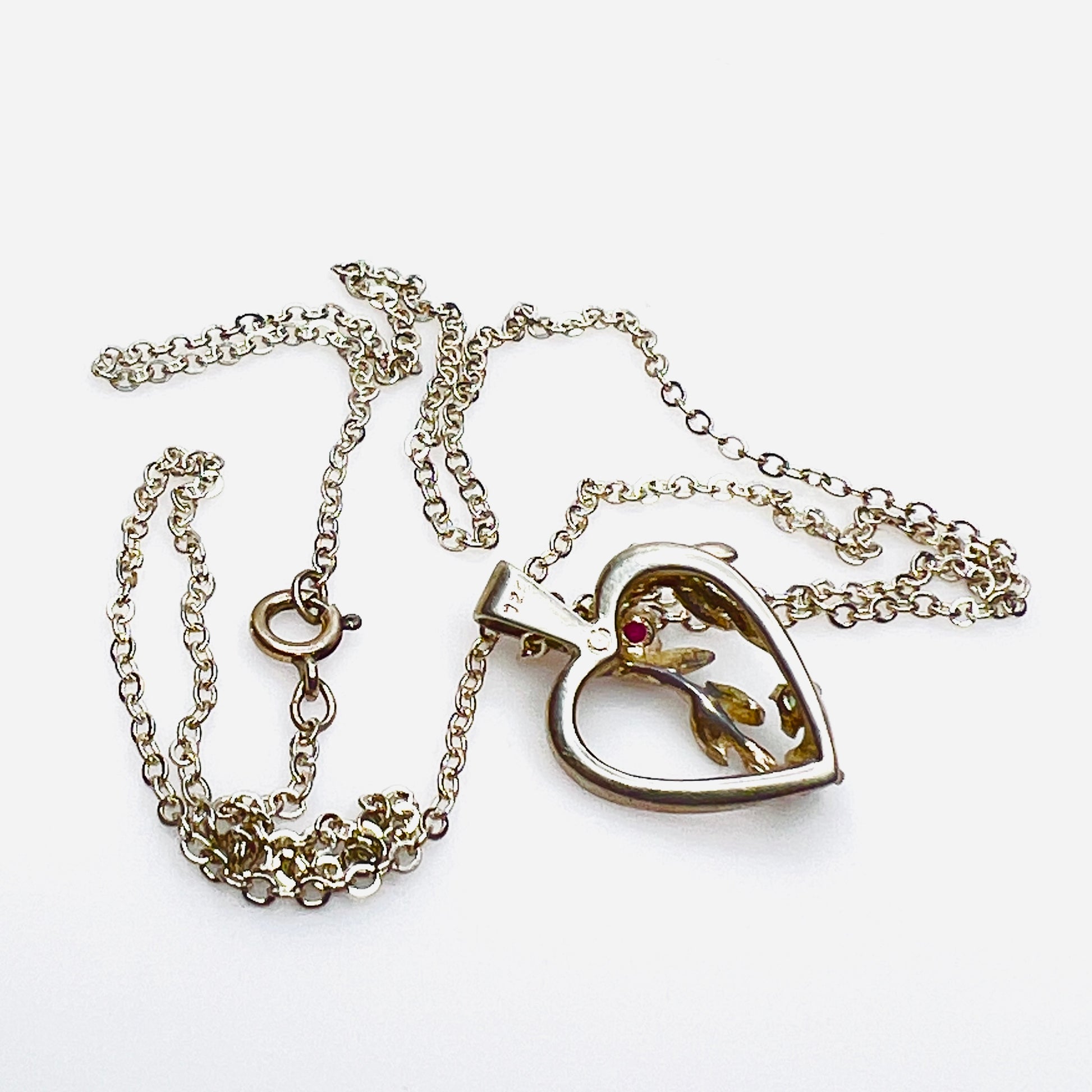 Reverse of sterling silver Avon heart pendant showing 925 hallmark.
