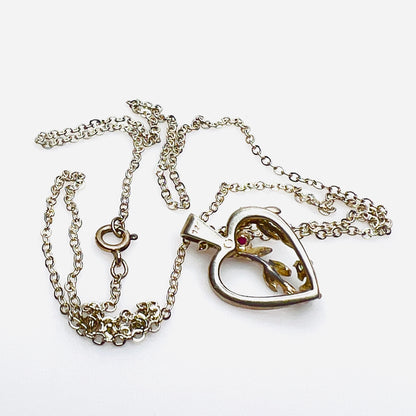 Reverse of sterling silver Avon heart pendant showing 925 hallmark.