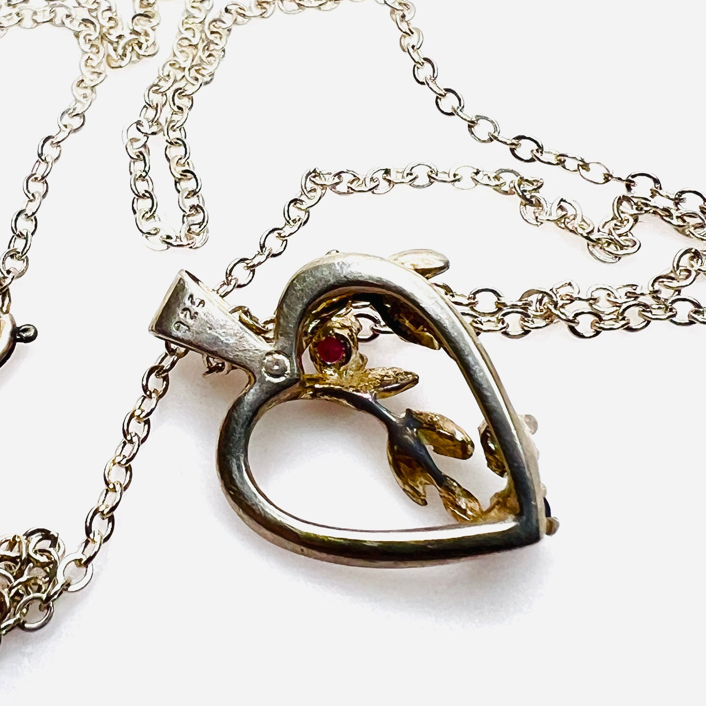 Reverse of sterling silver Avon heart pendant showing 925 hallmark.