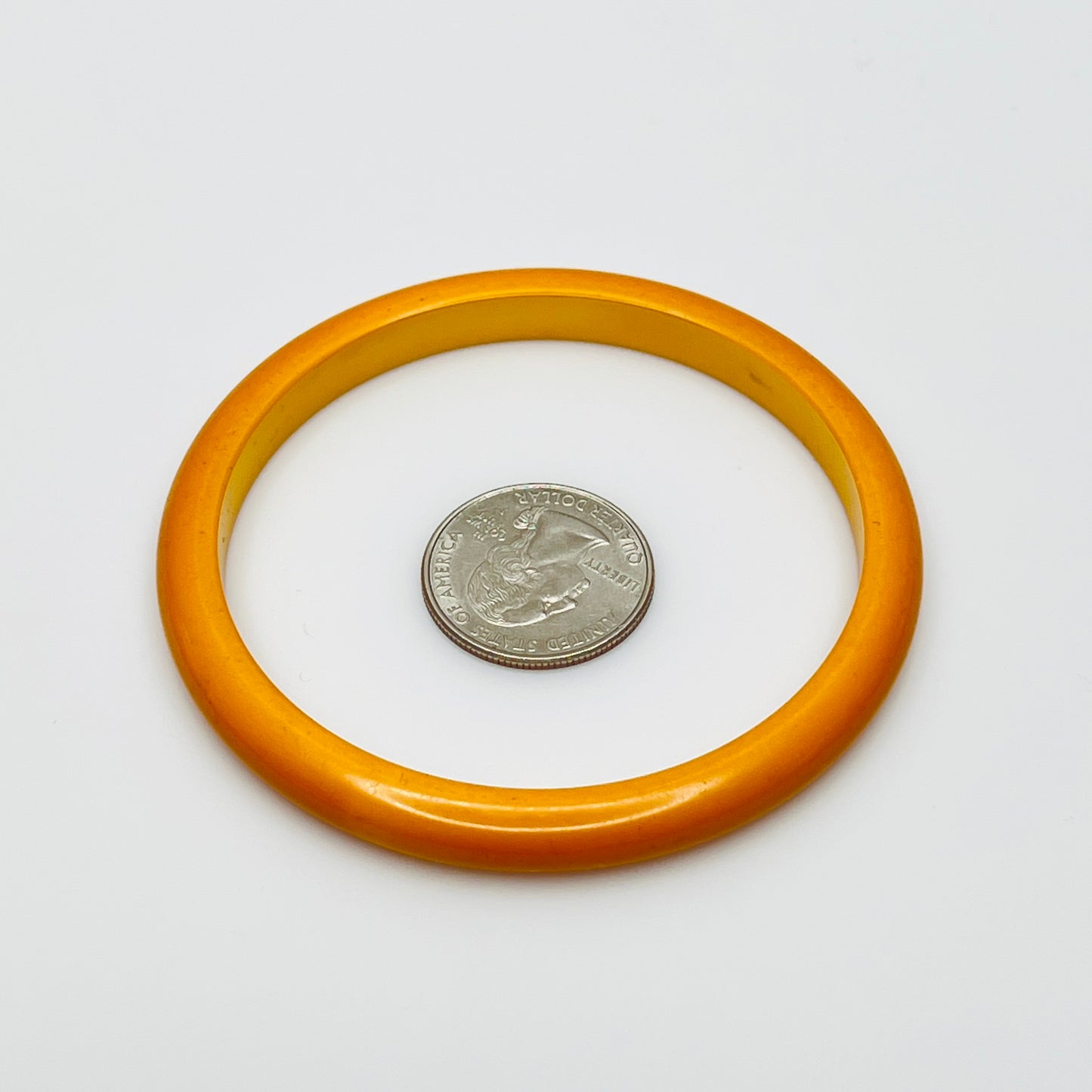 Smooth round Bakelite bangle in warm butterscotch color, size 8 fit