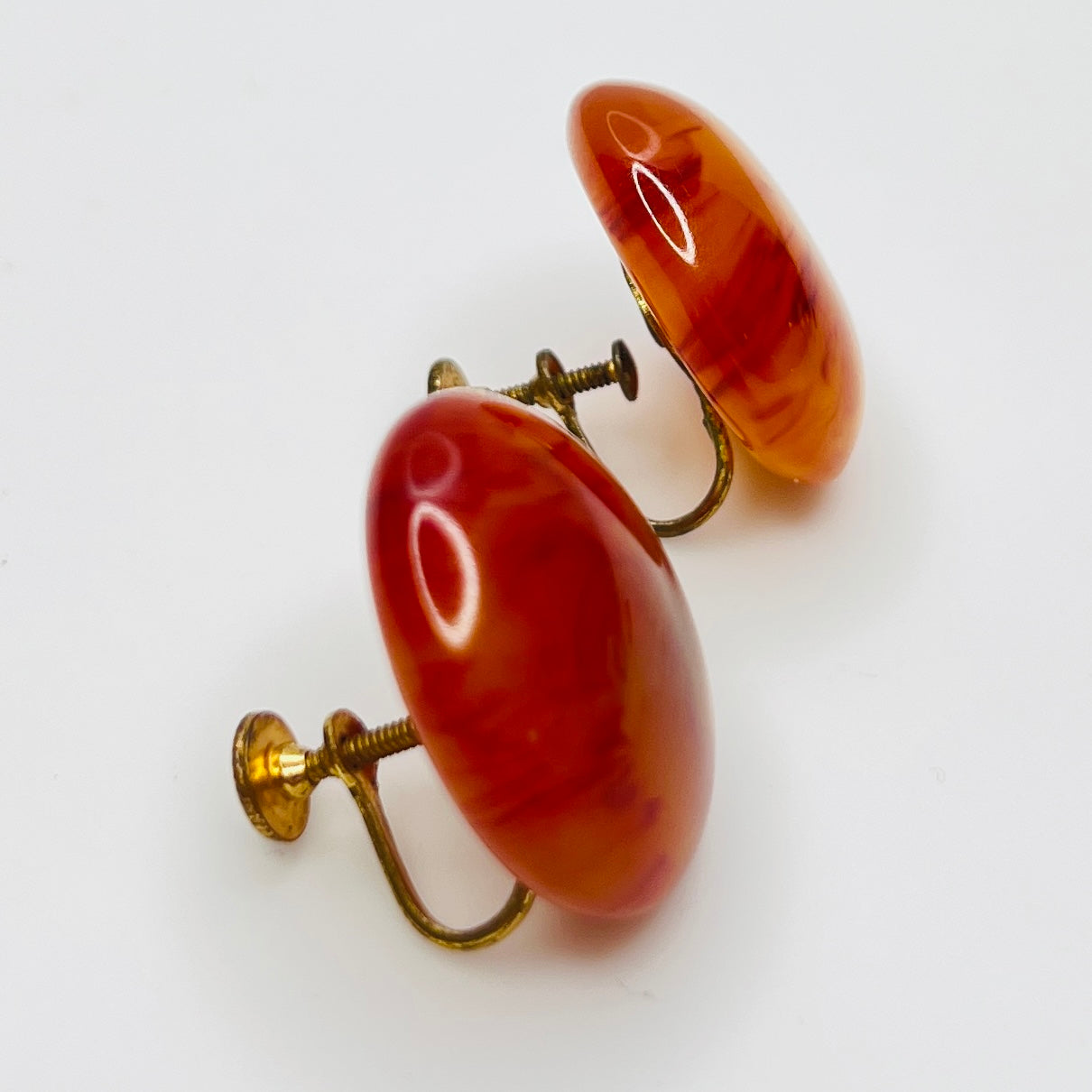 Amber and caramel marbled Bakelite round earrings