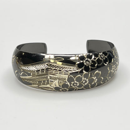 Blackened sterling cuff bracelet with Japanese temple and floral design