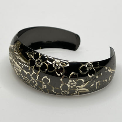 Blackened sterling cuff bracelet with Japanese temple and floral design