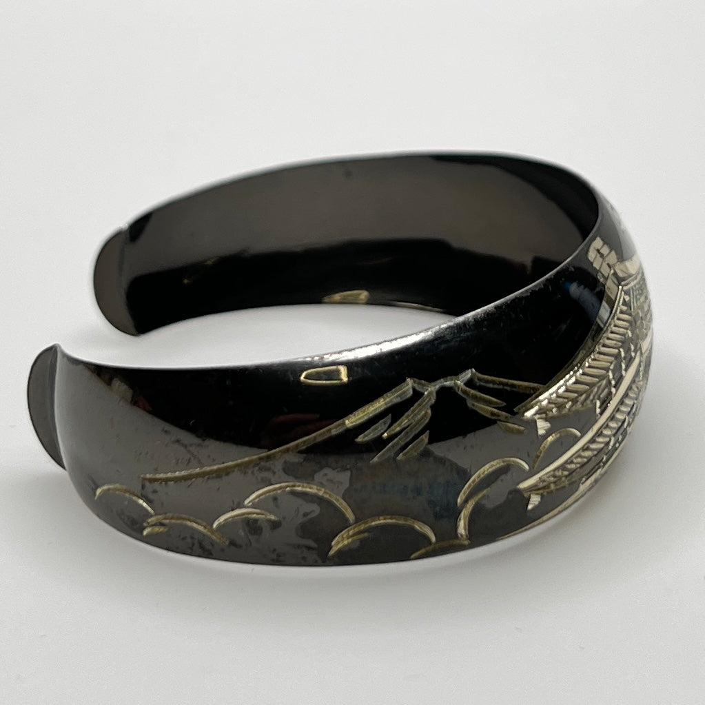 Blackened sterling cuff bracelet with Japanese temple and floral design