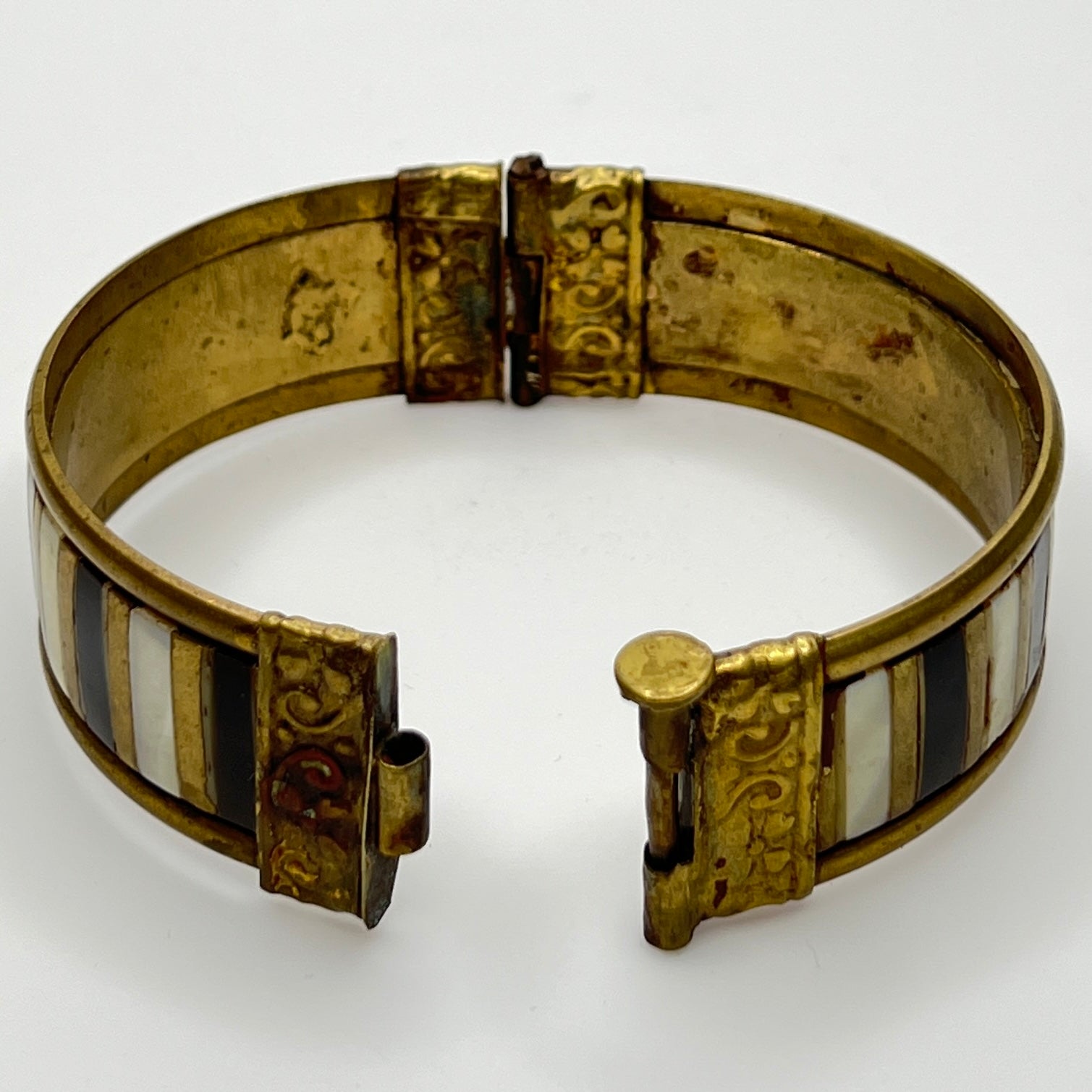 Open view showing unpolished brass patina and clasp mechanism