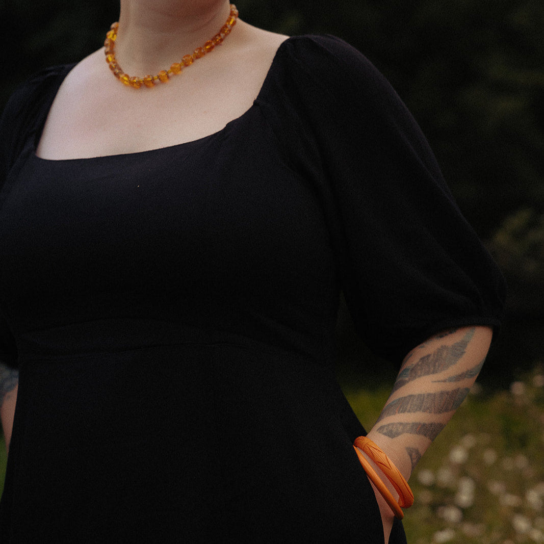 Carved Art Deco Bakelite bangle, ½ inch wide, size 7.75