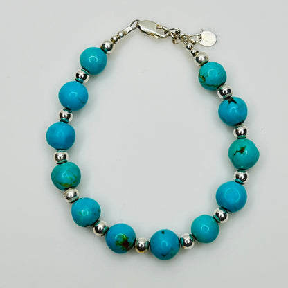Angled view of bracelet showing bead quality and clasp