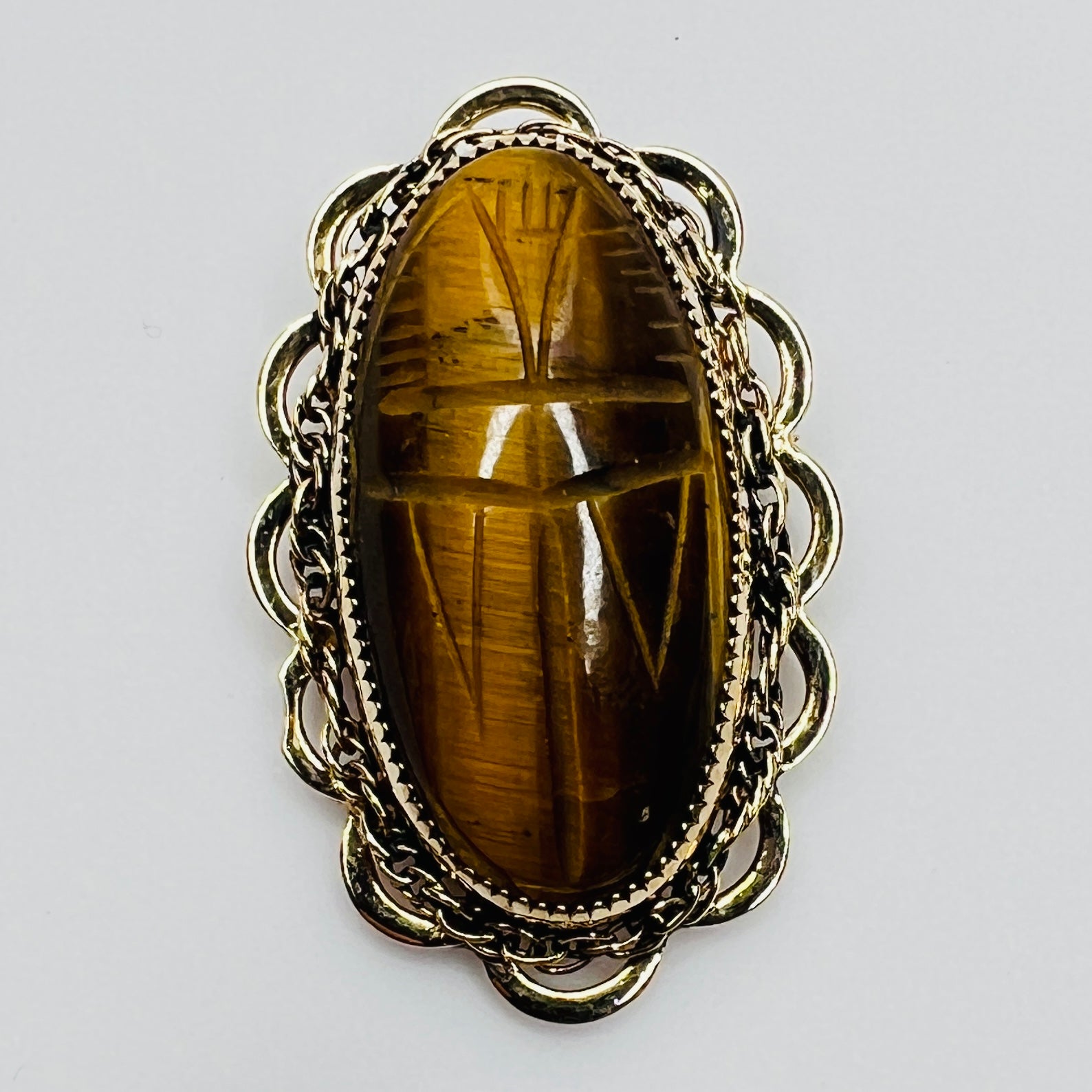 Vintage Catamore brooch with carved tiger’s eye scarab and gold-filled filigree frame