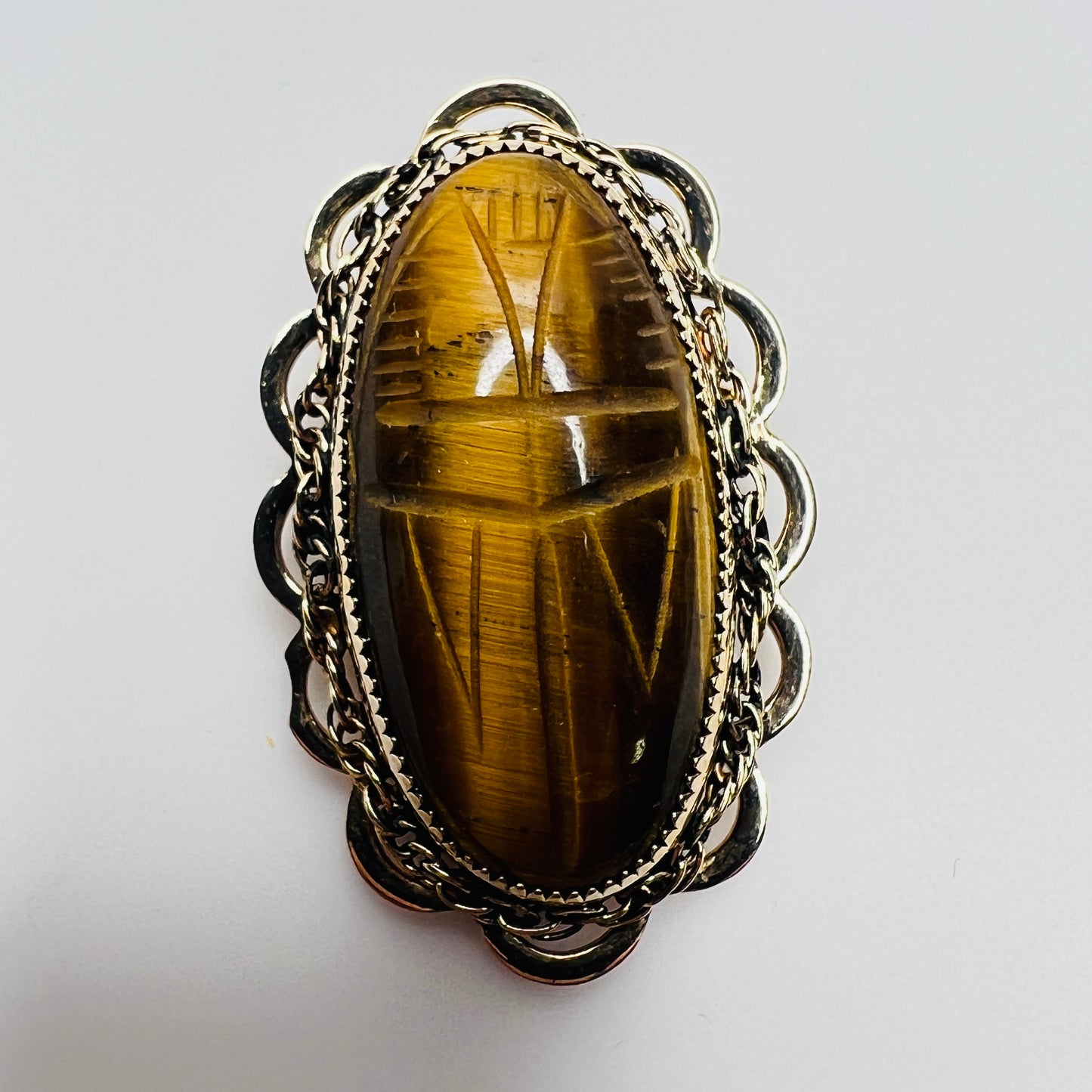 Vintage Catamore brooch with carved tiger’s eye scarab and gold-filled filigree frame