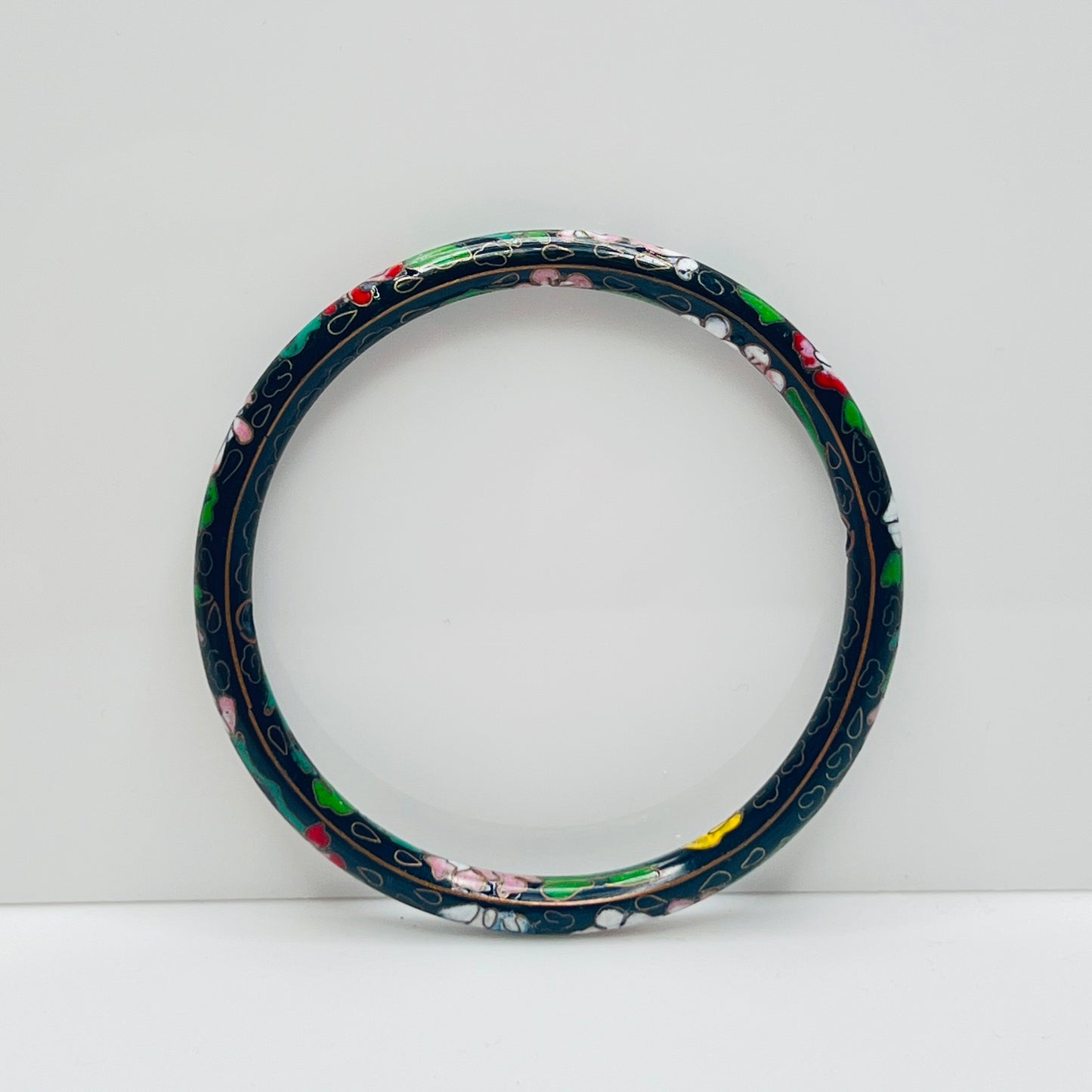 Close-up of cloisonné detail with gold wire outlines