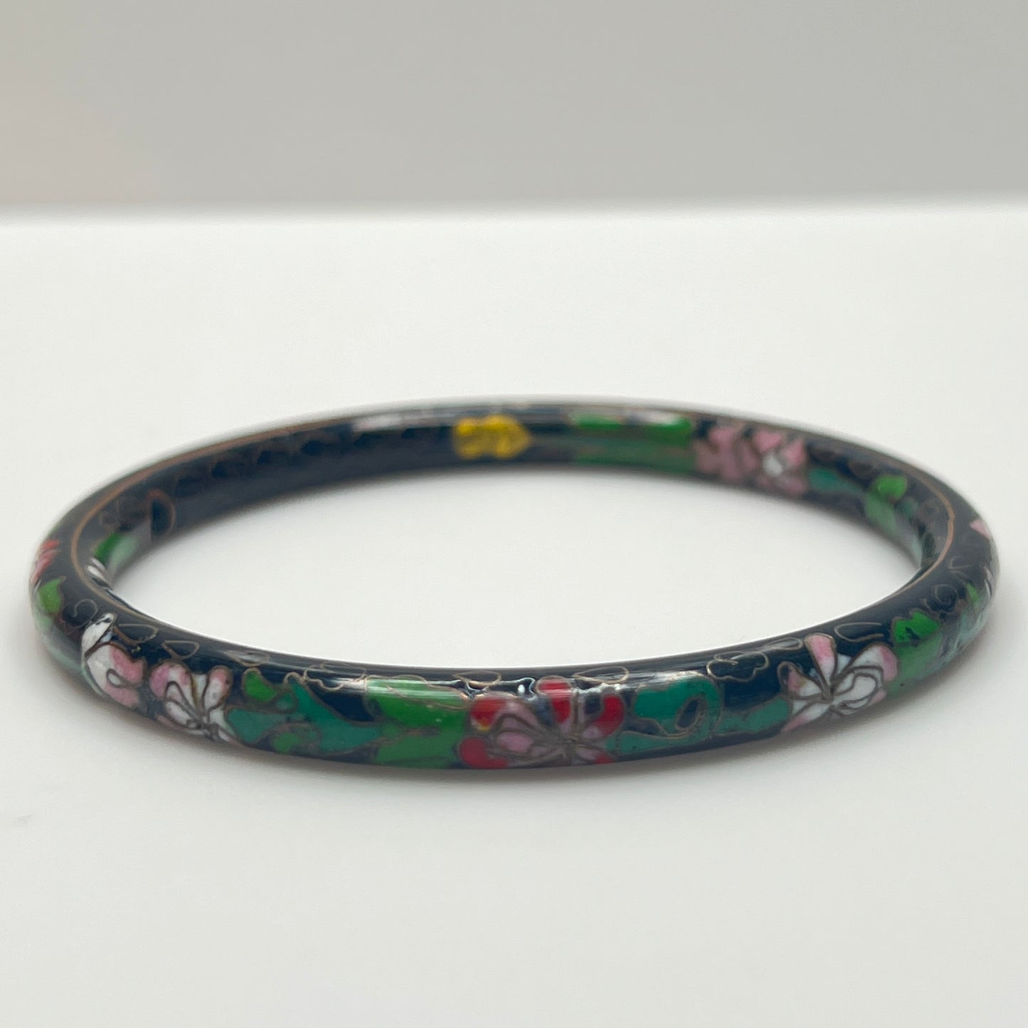 Close-up of cloisonné detail with gold wire outlines