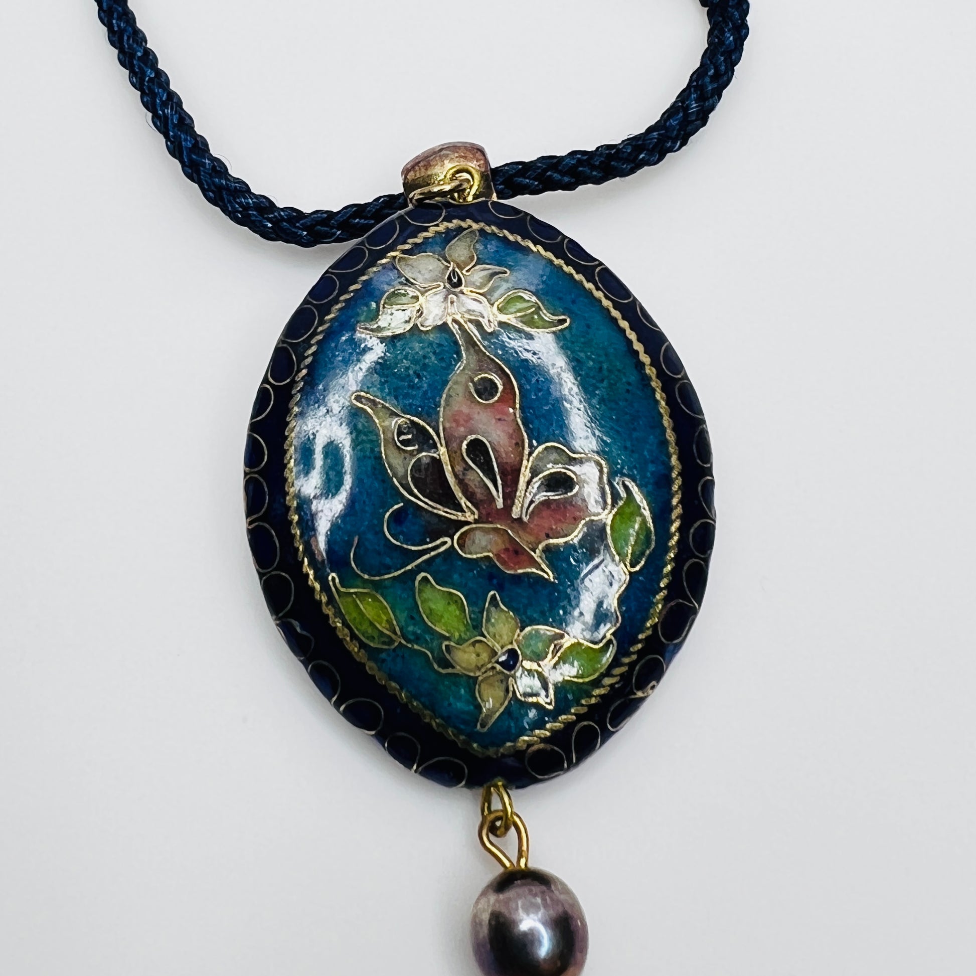 Detail of butterfly side of reversible enamel pendant