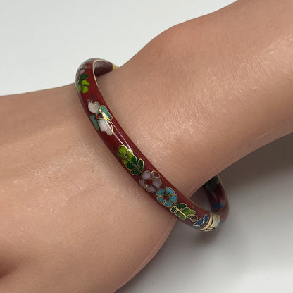 Side view of hinged cloisonné bracelet with gold detailing