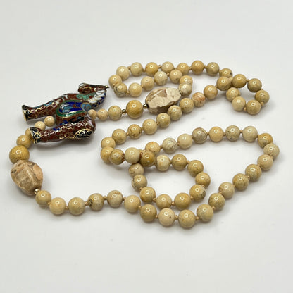 Hand-knotted beige stone bead strand with asymmetrical design