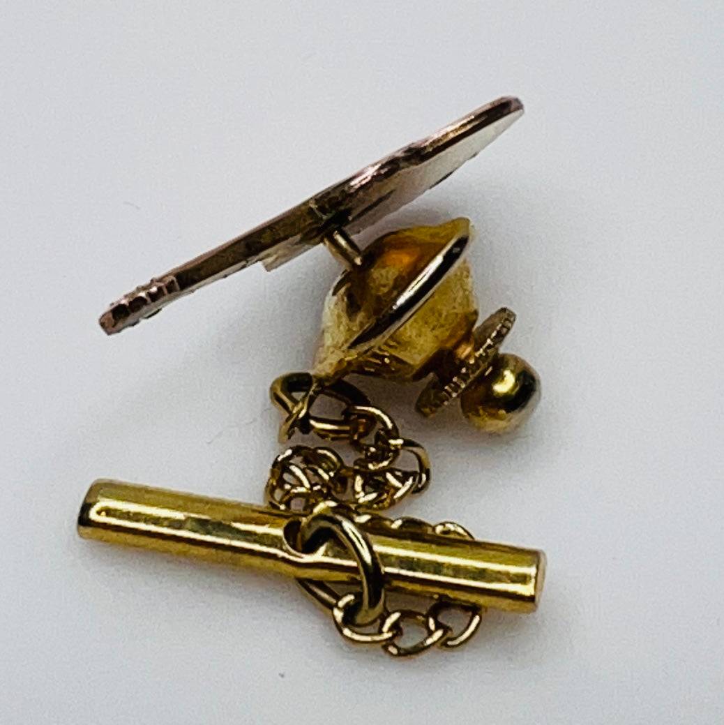 1960s copper guitar tie tack with gold tone chain and detailed fretwork