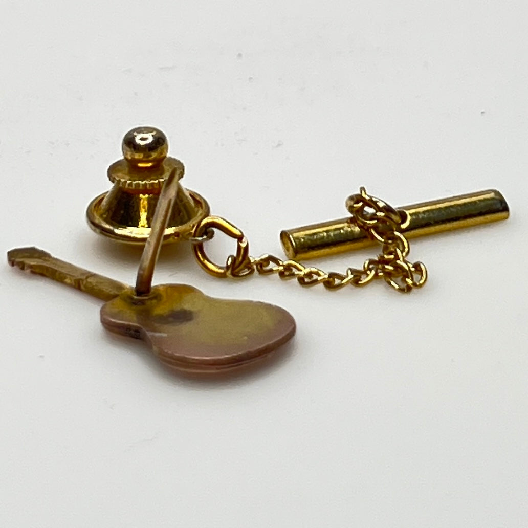 Back view showing tack clutch and gold tone safety chain