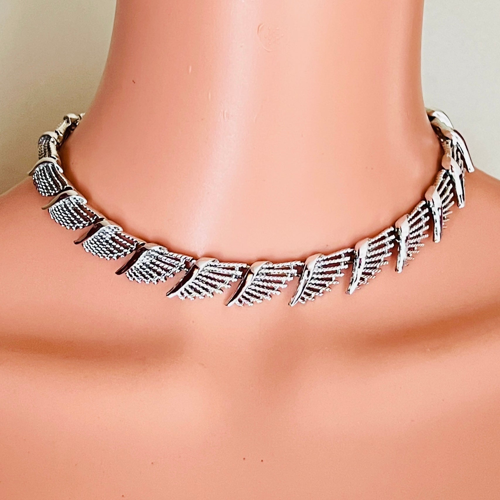 Vintage Coro silver-tone fan link choker worn on mannequin