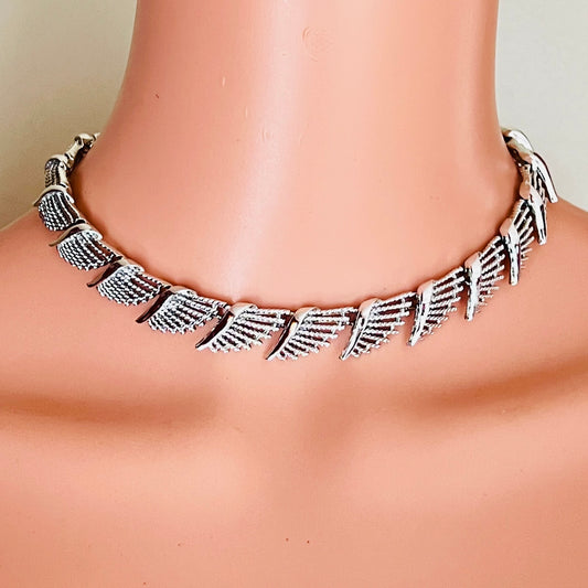Vintage Coro silver-tone fan link choker worn on mannequin