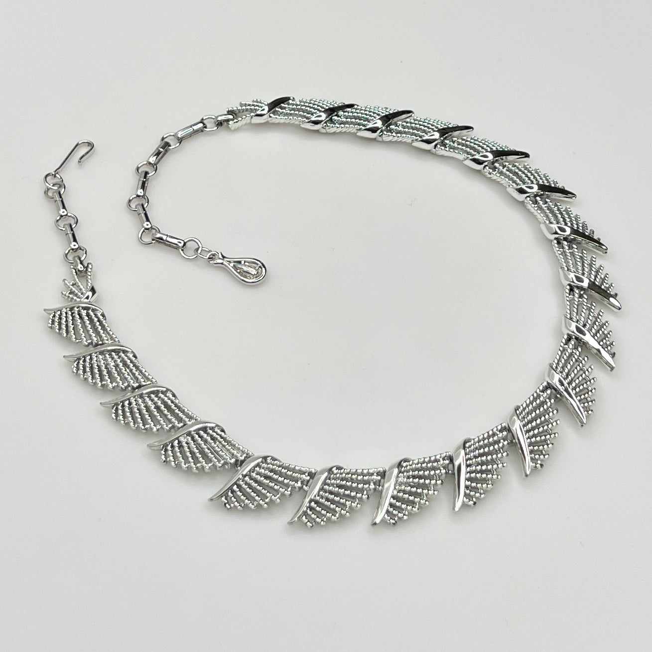 Side view of textured and polished mid-century fan design