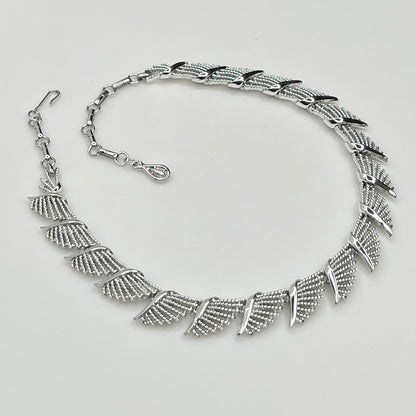 Side view of textured and polished mid-century fan design