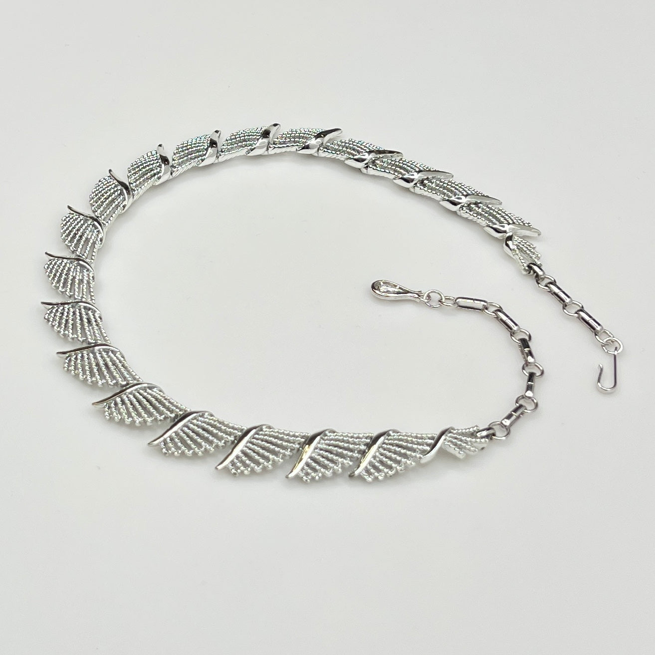 Side view of textured and polished mid-century fan design