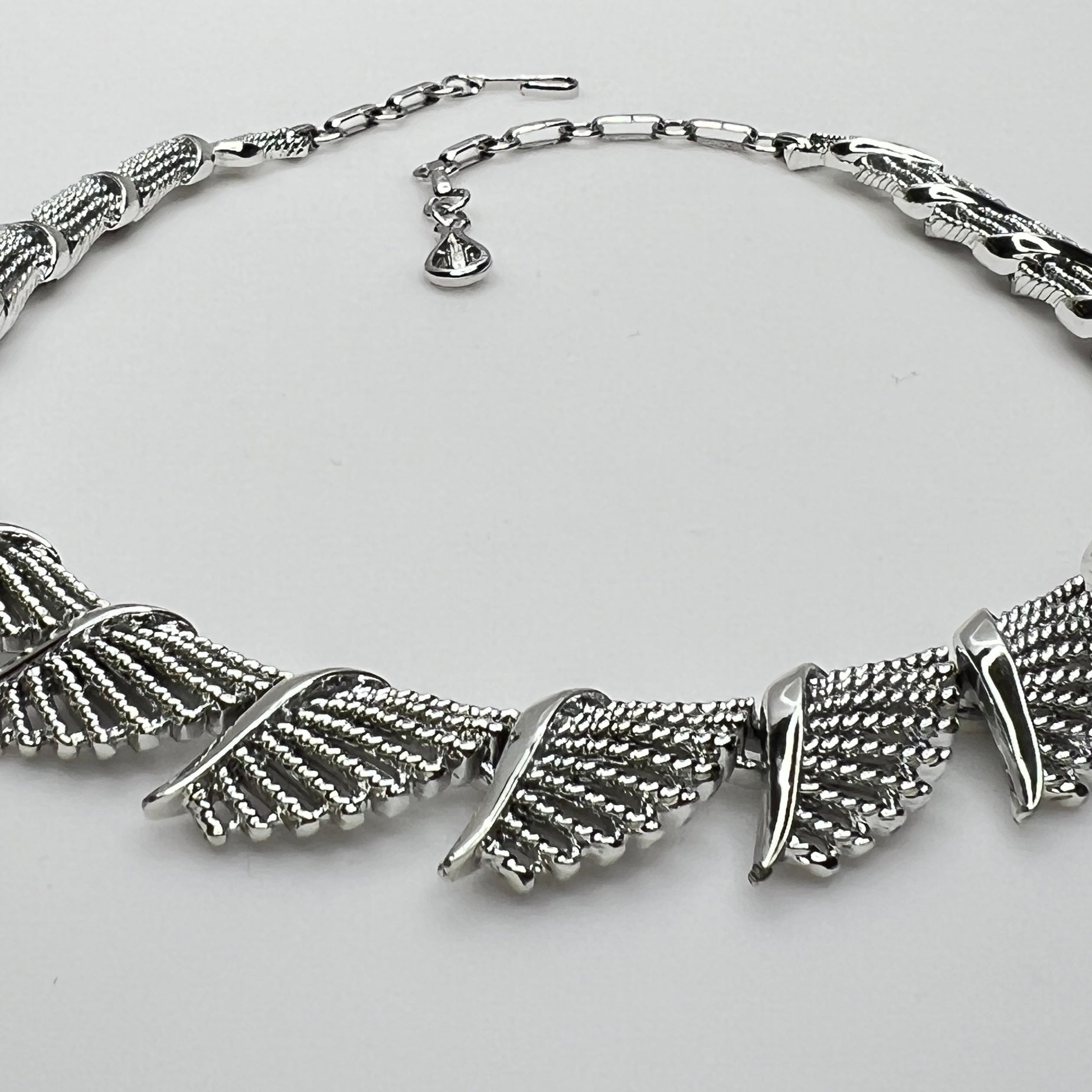 Side view of textured and polished mid-century fan design