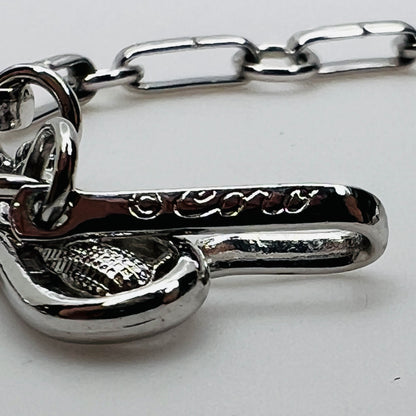 Close-up of signed Coro hook clasp on vintage choker necklace