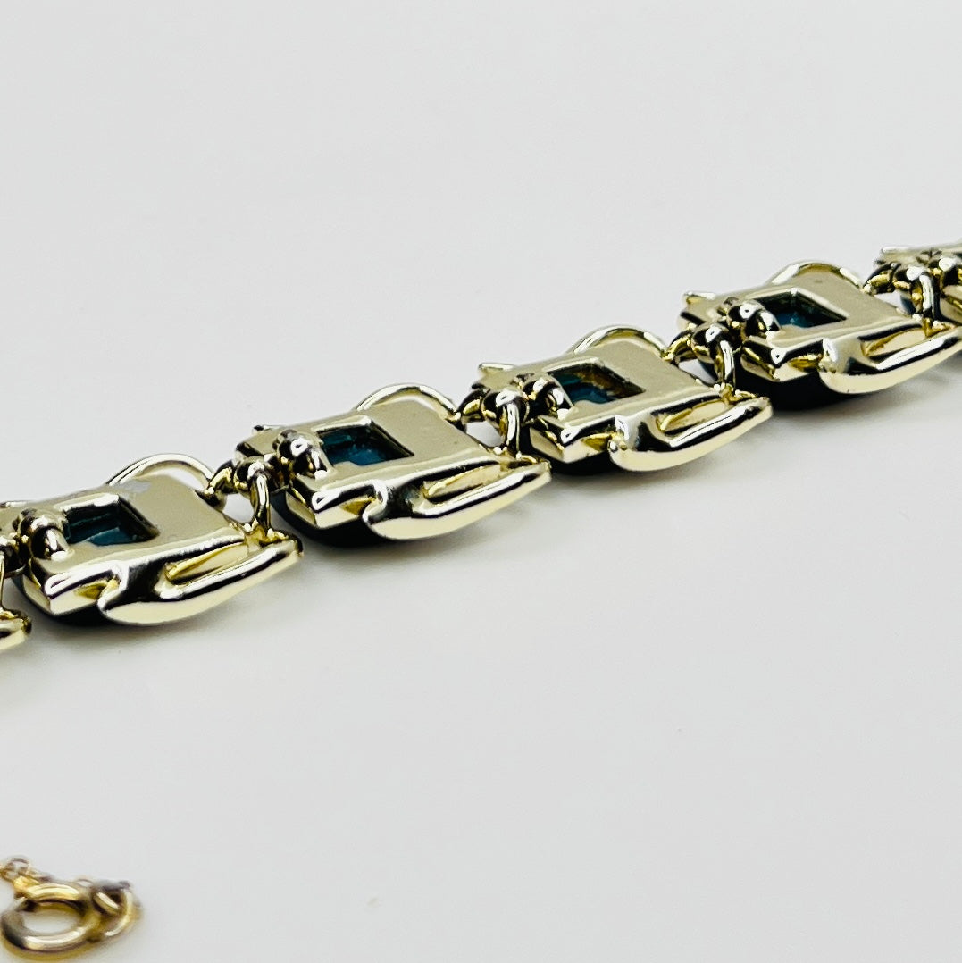 Vintage Coro bracelet with marbled blue thermoset cabochons, laid flat