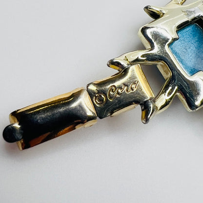 Close-up of fold-over clasp signed ©Coro in gold-tone finish