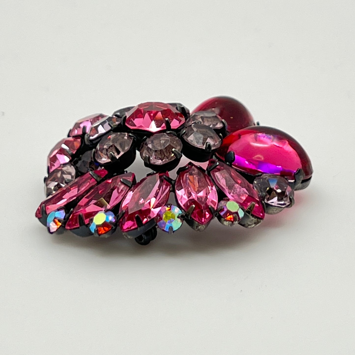1960s pink glass rhinestone brooch with matching aurora borealis earrings