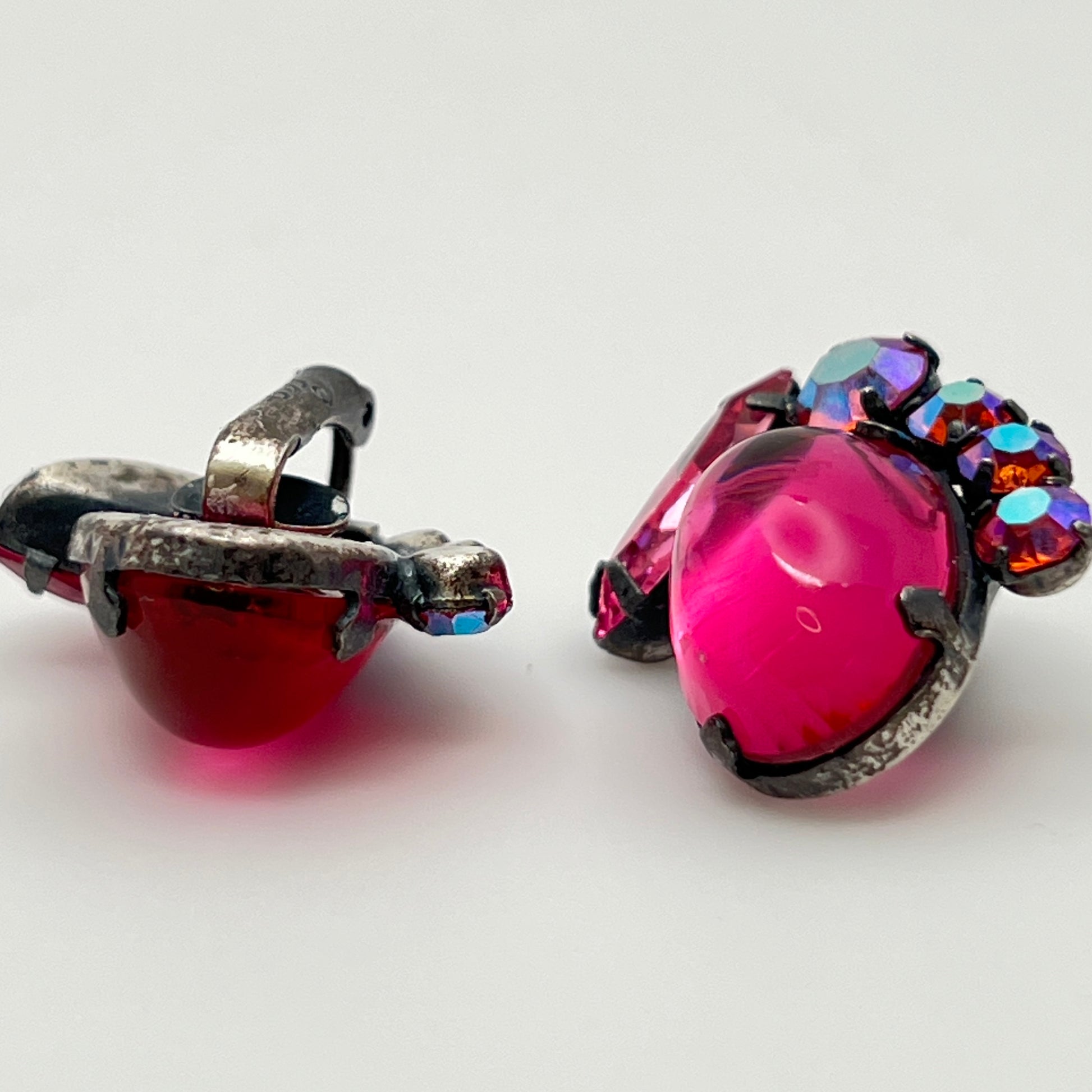 Close-up of signed Coro earrings with prong-set rhinestones