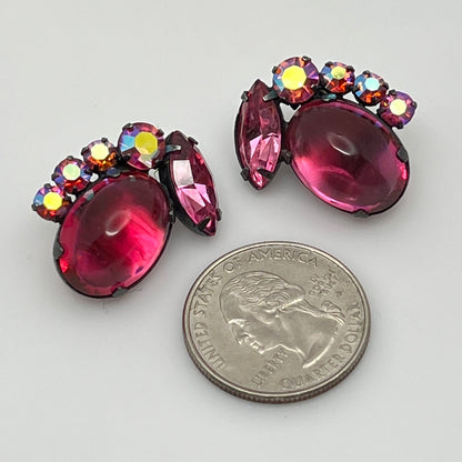 Close-up of signed Coro earrings with prong-set rhinestones