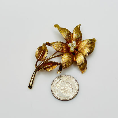 Close-up of signed Coro brooch featuring dimensional flower design
