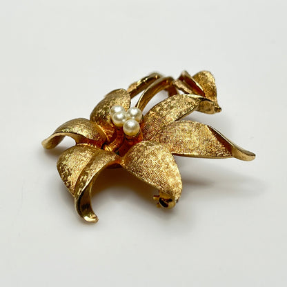 Close-up of signed Coro brooch featuring dimensional flower design