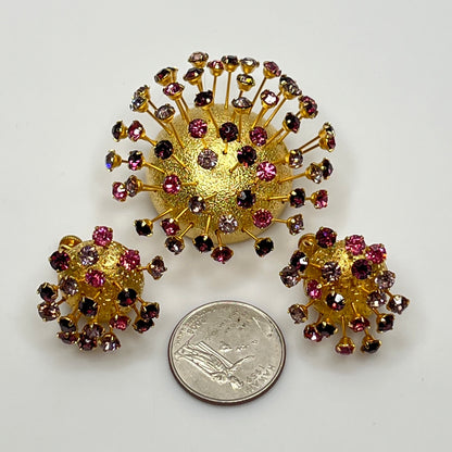 Corocraft goldtone Sputnik brooch with pink and purple rhinestones, mid-century style