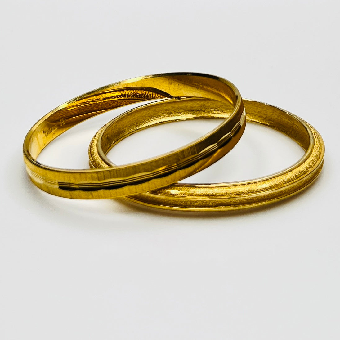 Crown Trifari gold tone etched bangle set 1970s