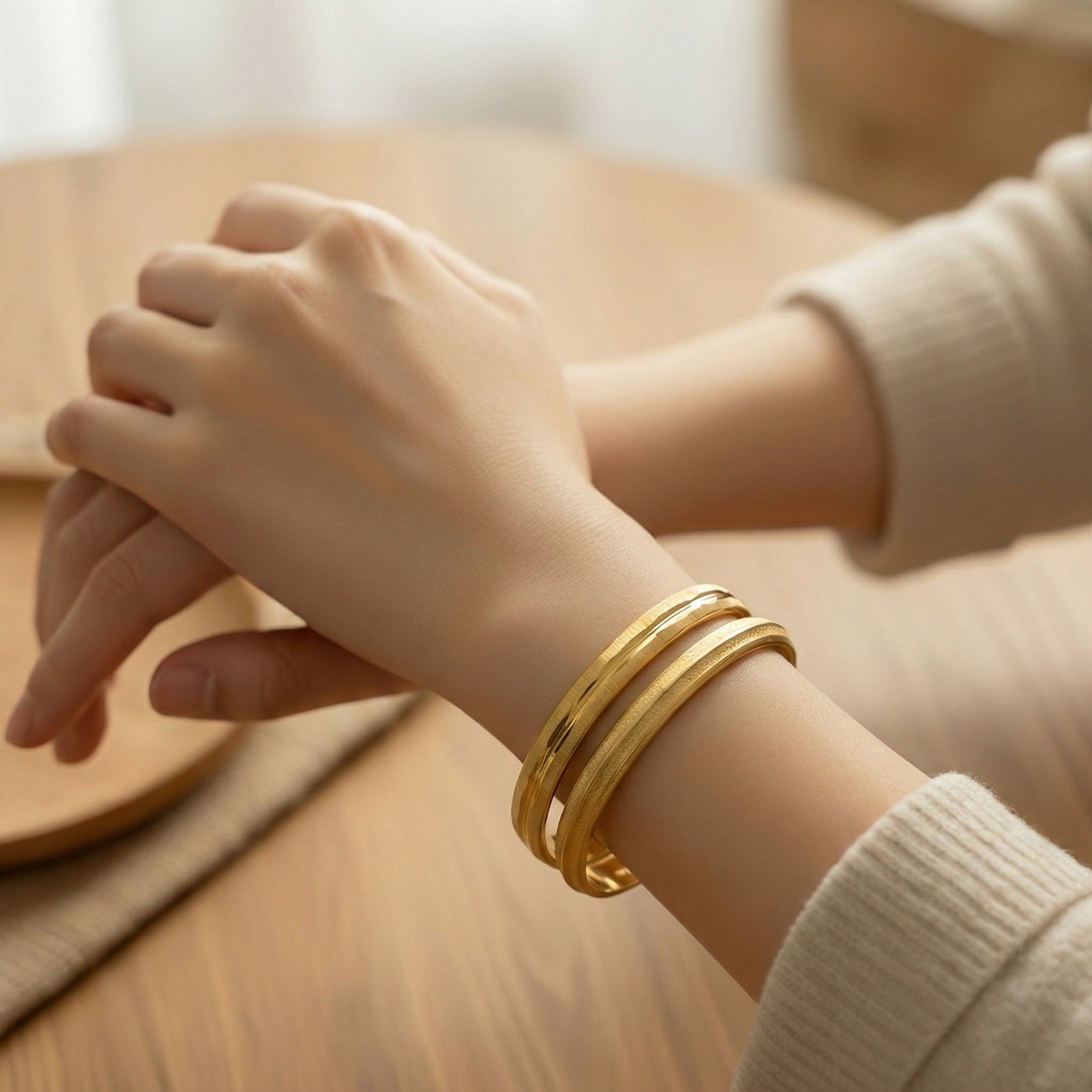 Vintage gold Crown Trifari bangles stacked on wrist
