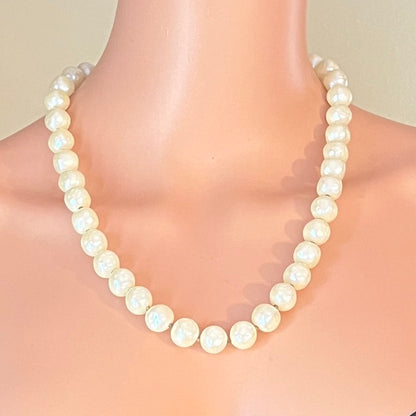 Vintage Trifari pearl necklace worn on mannequin