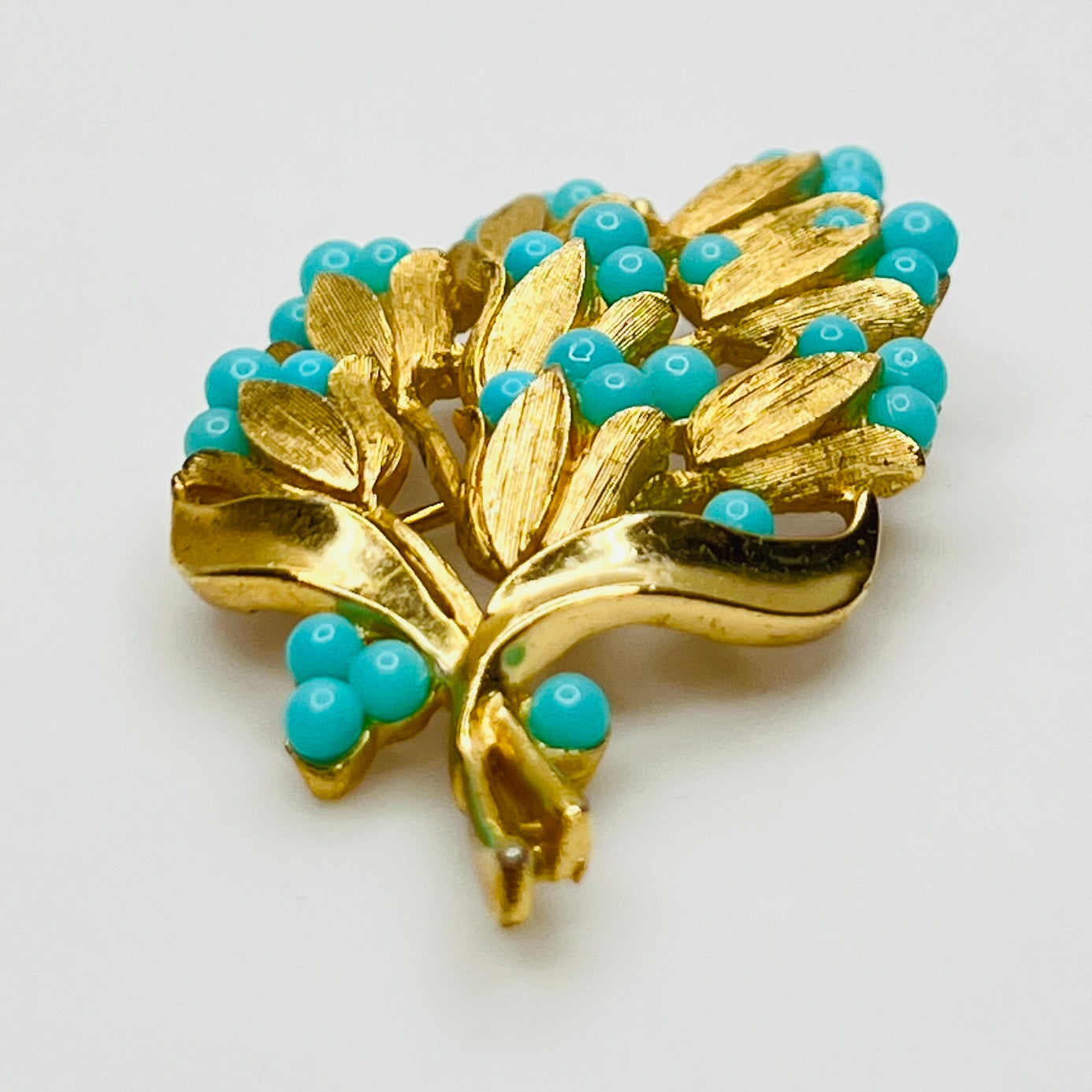 1950s Crown Trifari turquoise lily of the valley brooch