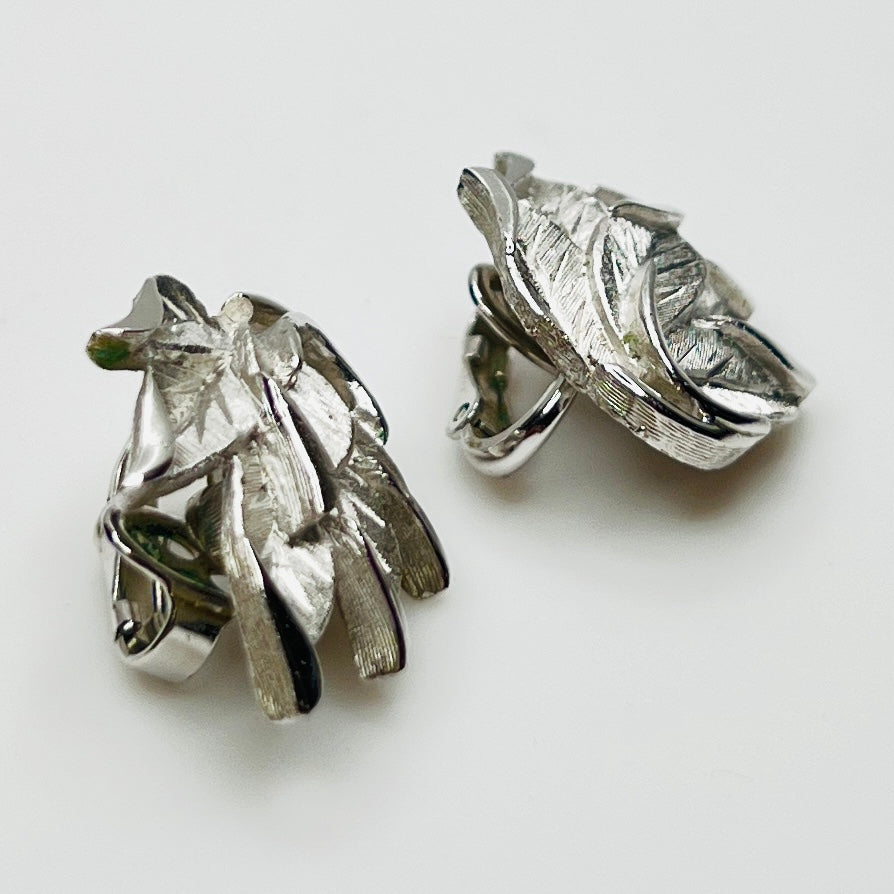 Side view Crown Trifari silver tone layered leaf clip earrings