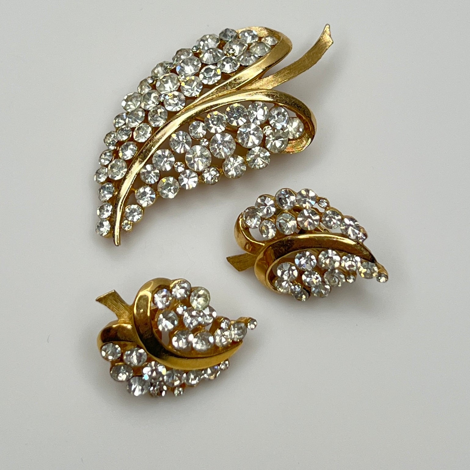 Vintage gold-tone Trifari leaf brooch and rhinestone earrings set