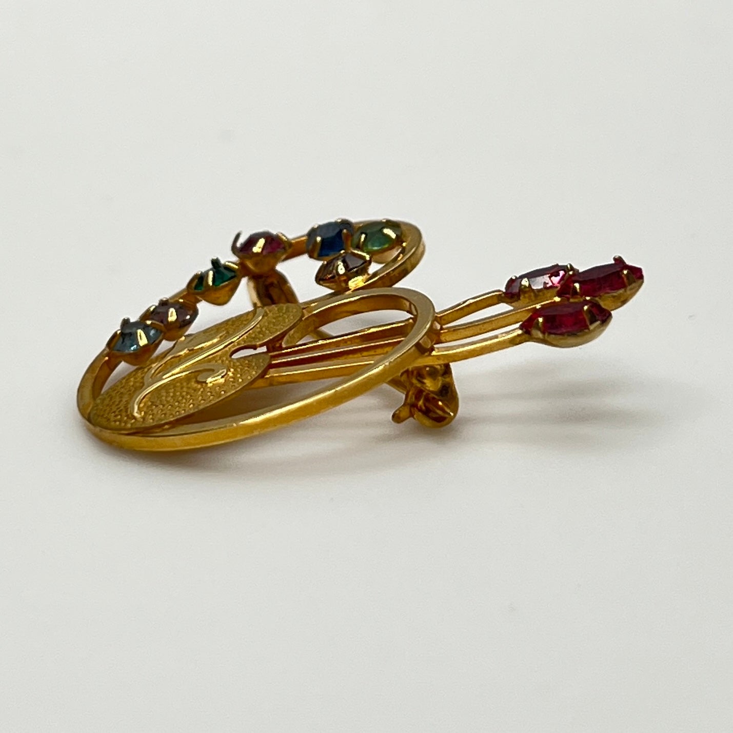 Close-up of engraved palette with pink paintbrush rhinestones