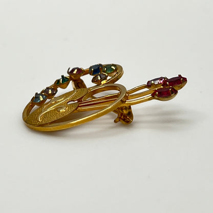 Close-up of engraved palette with pink paintbrush rhinestones