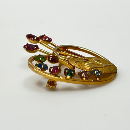 Close-up of engraved palette with pink paintbrush rhinestones