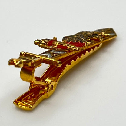 Close-up angled view of Spanish-style vintage tie bar with sword shape