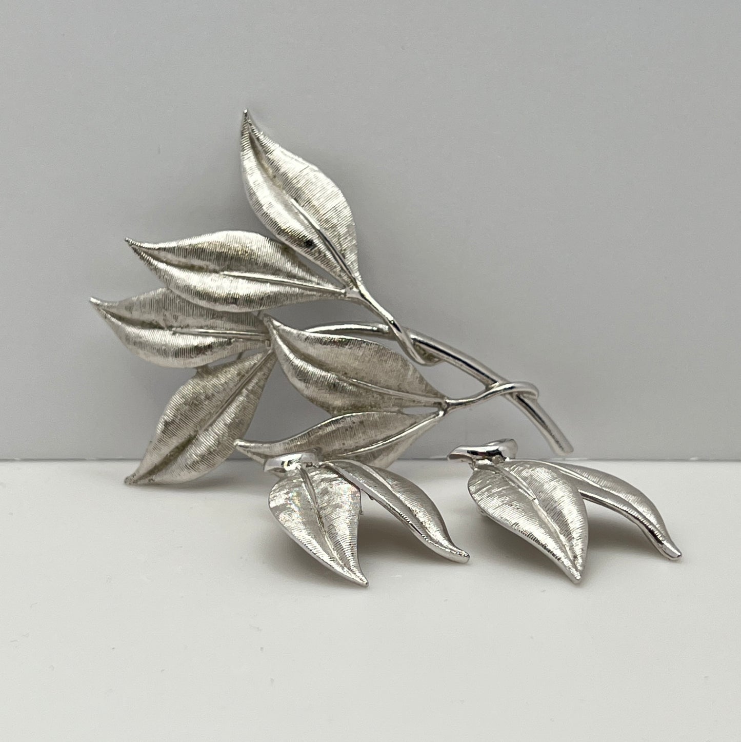 Vintage Emmons silver leaf brooch with matching clip-on earrings