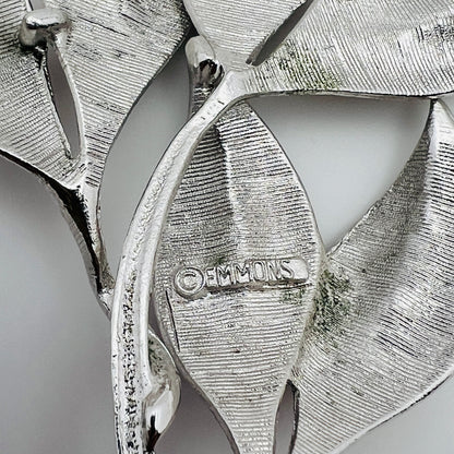 Close-up of Emmons signature on vintage silver leaf brooch