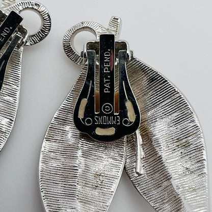 Close-up of Emmons signature on vintage silver leaf earrings