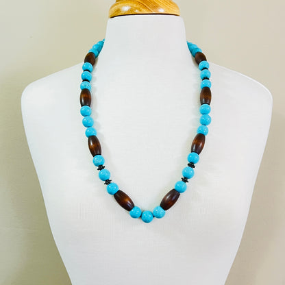 EXEX sterling silver and turquoise necklace with wood beads displayed on mannequin bust